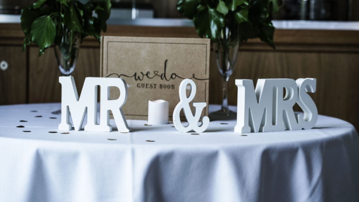 white Mr & Mrs freestanding letters on table with white spread